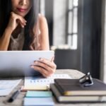 A woman reviews her investment portfolio.